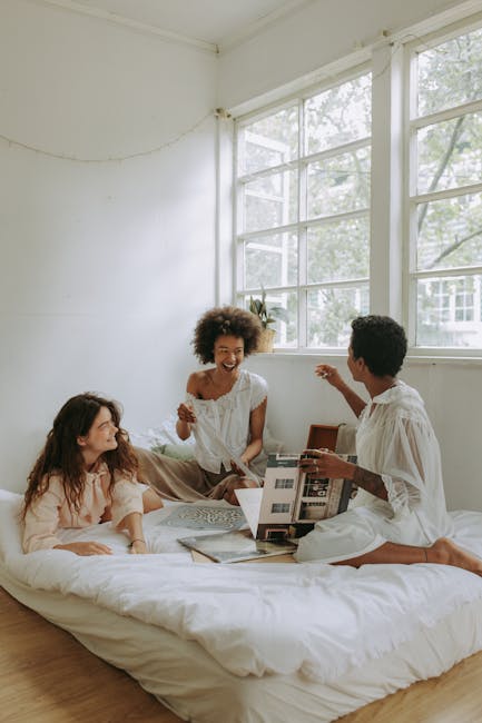 Group of diverse women chatting and laughing together after a yoga class.
